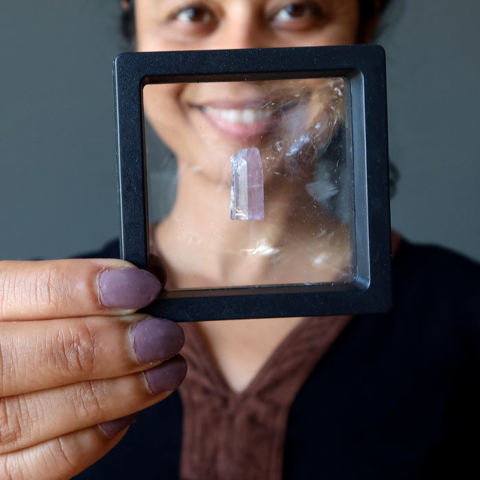 rough pink tourmaline gemstone in suspension case