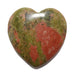 Heart-shaped unakite gemstone with green and red patterns on a white background
