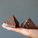 two orange unakite pyramids