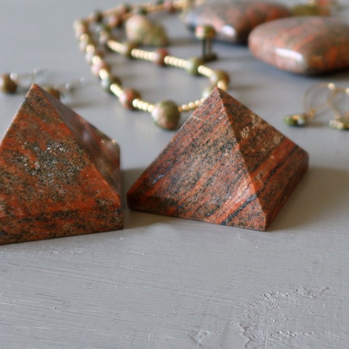 two orange unakite pyramids