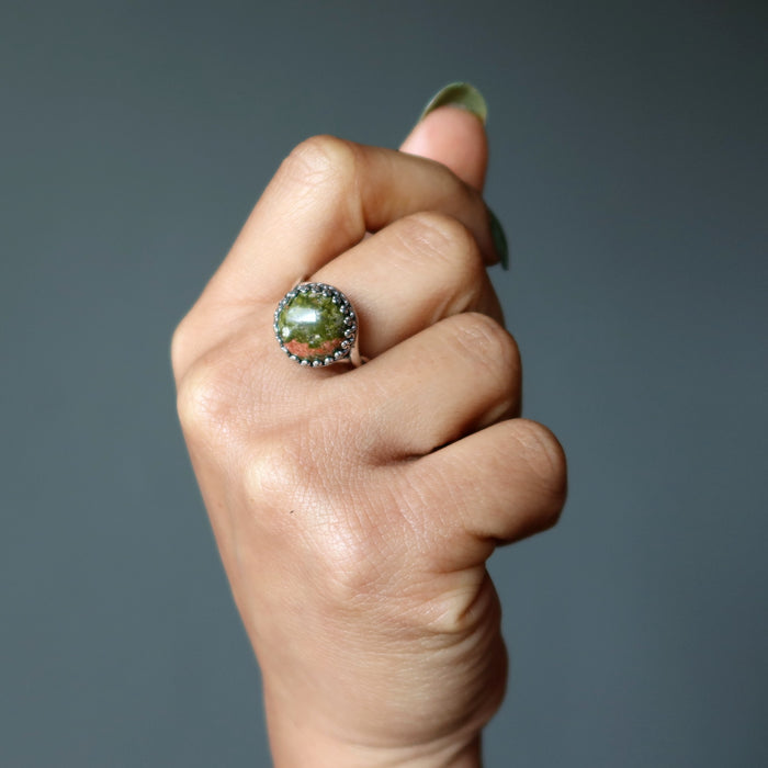 round unakite sterling silver ring on hand
