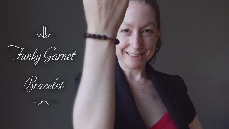video of female modeling faceted red garnet bracelet