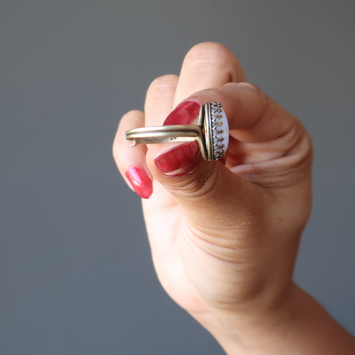 showing a side of Antique Adjustable Brass Oval Blue Lace Agate Ring