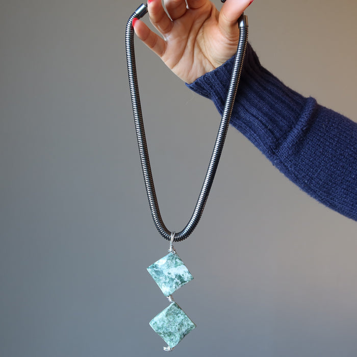 hand holding Tree Agate Necklace