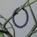dark amethyst bracelet on green branches
