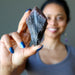 sheila of satin crystals holding raw super 7 amethyst crystal point