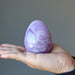 palm holding an amethyst egg