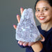 woman holding amethyst geode
