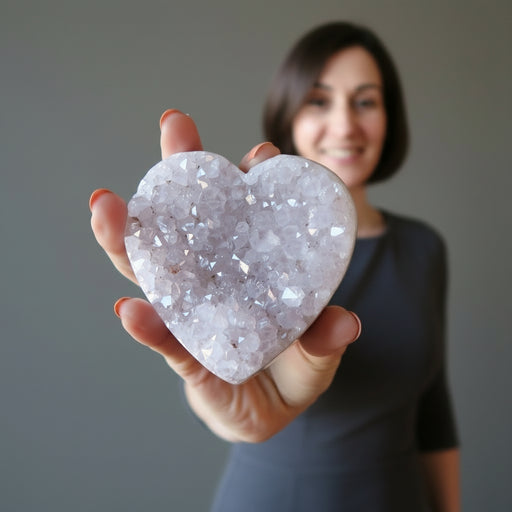 female model hodling 3.0-3.75 Inches violet amethyst heart crystal cluster