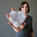 female model hodling 3.0-3.75 Inches violet amethyst heart crystal cluster