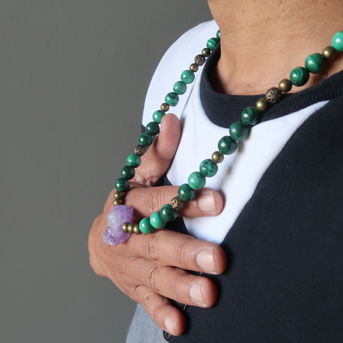 a male model wearing raw amethyst malachite beaded necklace
