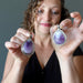 female model holding female model holding 2.3 x 1.5 inches Teardrop Purple Amethyst silver framed Pendant in each hand 