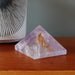 amethyst pyramid on table