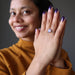 sheila of satin crystals wearing a faceted oval amethyst gemstone in silver ring