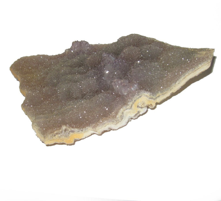 5.3" x 3.8" x 0.6"  Sparkling Purple Flower Amethyst Cluster laying on the white back ground