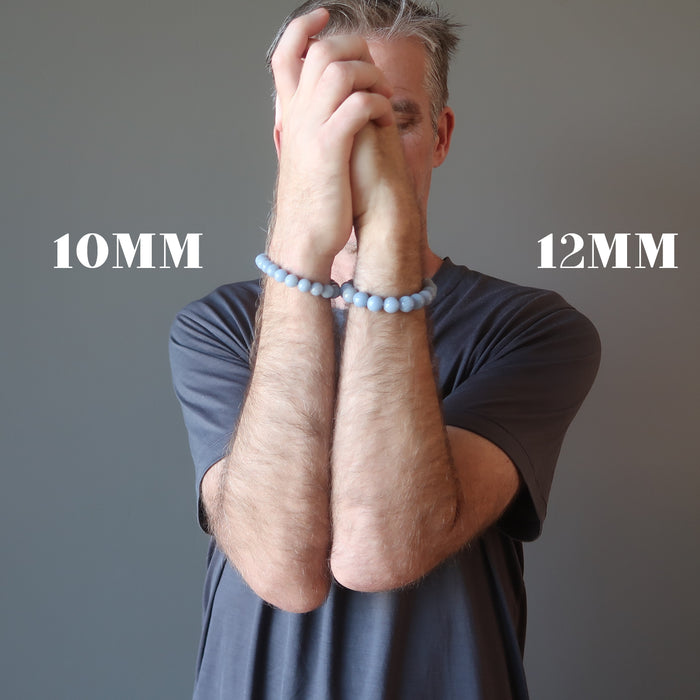 man wearing blue angelite bracelets on each wrist