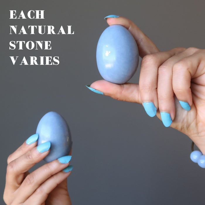 hand holding angelite eggs showing each varies