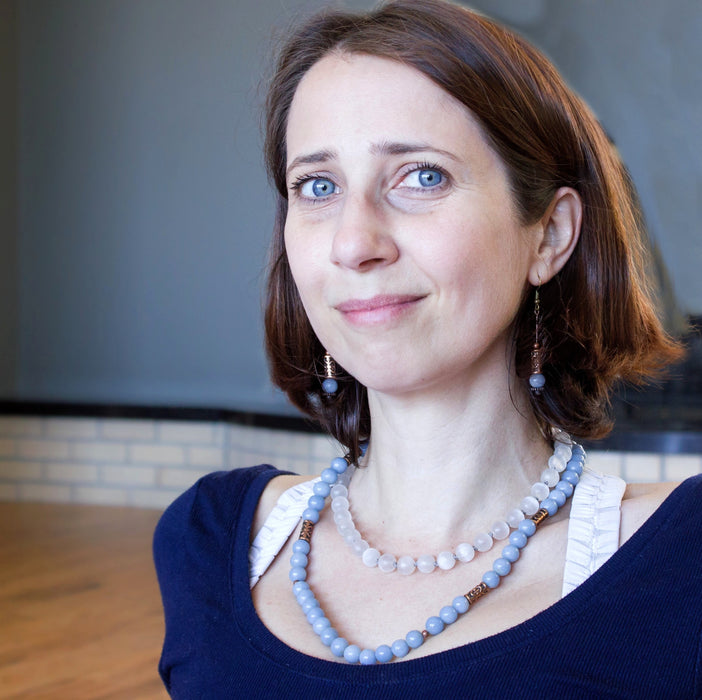woman wearing a beaded angelite necklace