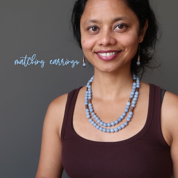 woman wearing a beaded angelite necklace and earrings