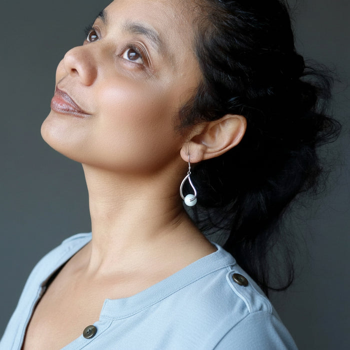 sheila of satin crystals wearing aquamarine earrings