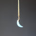 aquamarine crescent moon pendant on gold necklace