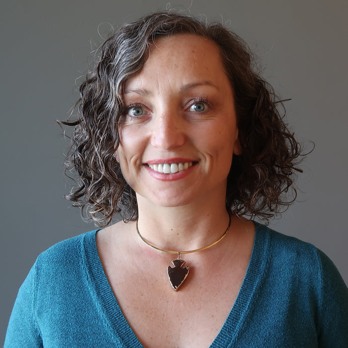 smoky quartz arrowhead necklace on female neck