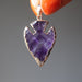 holding purple Arrowhead gold plated framed Amethyst Pendant
