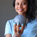 sheila of satin crystals holding blue aventurine sphere