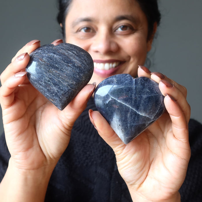 woman holding dark blue aventurine hearts