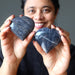 woman holding dark blue aventurine hearts
