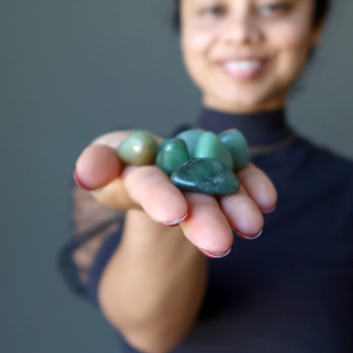 sheila of satin crystals holding green aventurine tumbled stone set 