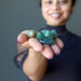 sheila of satin crystals holding green aventurine tumbled stone set 