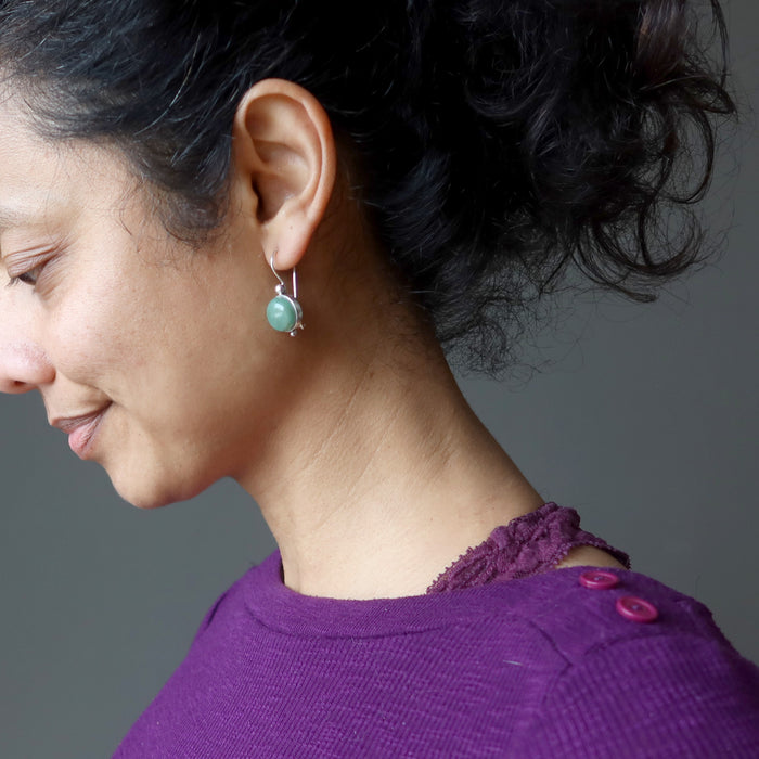 female wearing green aventurine sterling silver earrings