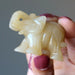 hand holding Golden Aventurine Elephant Figurine