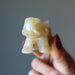 hand holding Golden Aventurine Elephant Figurine