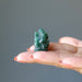 green aventurine ganesh on palm
