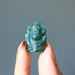 holding green aventurine ganesh