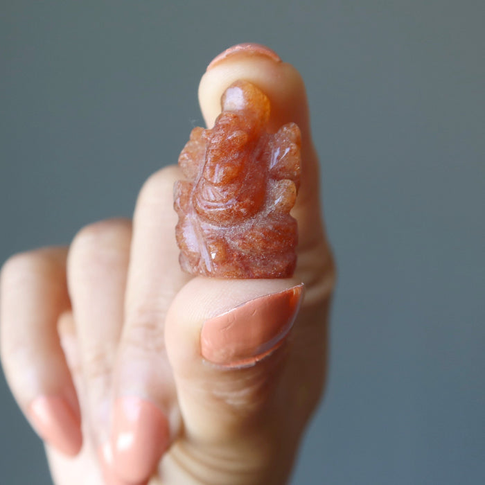 holding orange aventurine ganesh
