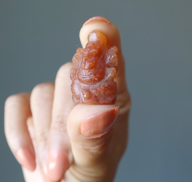 holding orange aventurine ganesh