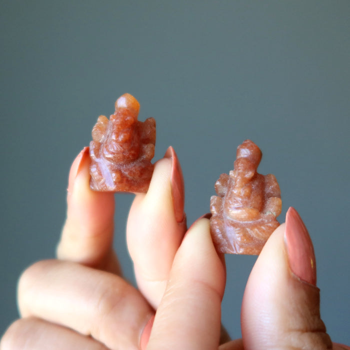 orange aventurine ganesh on each hand