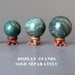 three aventurine spheres on wood display stands which are sold separately
