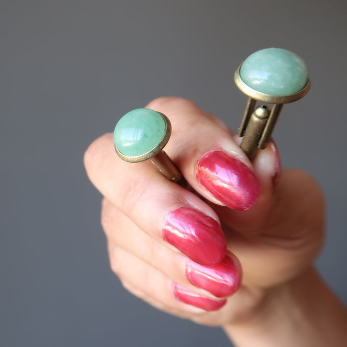 hands holding green aventurine antique bronze cufflinks