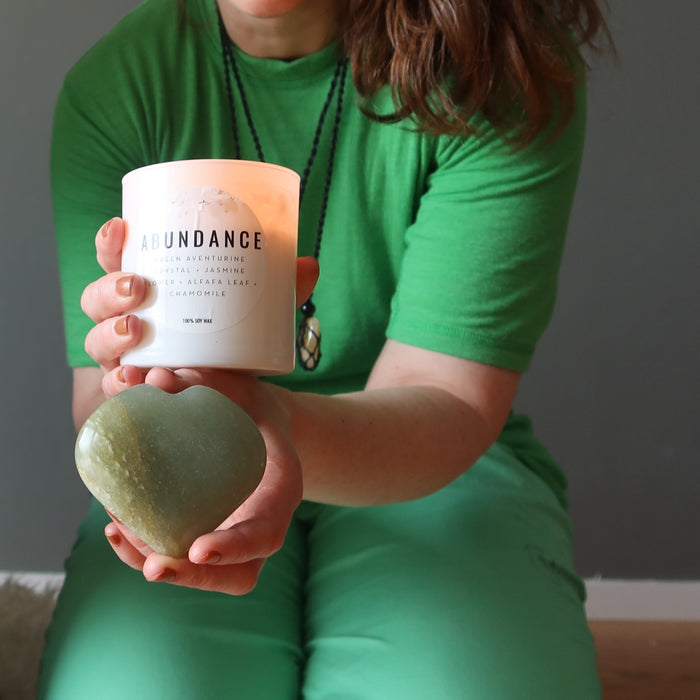 dark green aventurine hearts under abundance candle