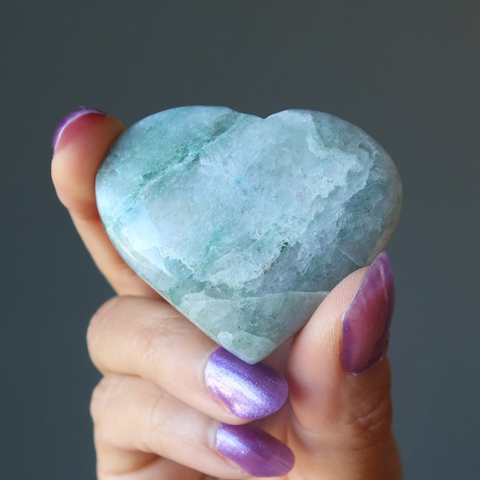 hand holding aventurine heart