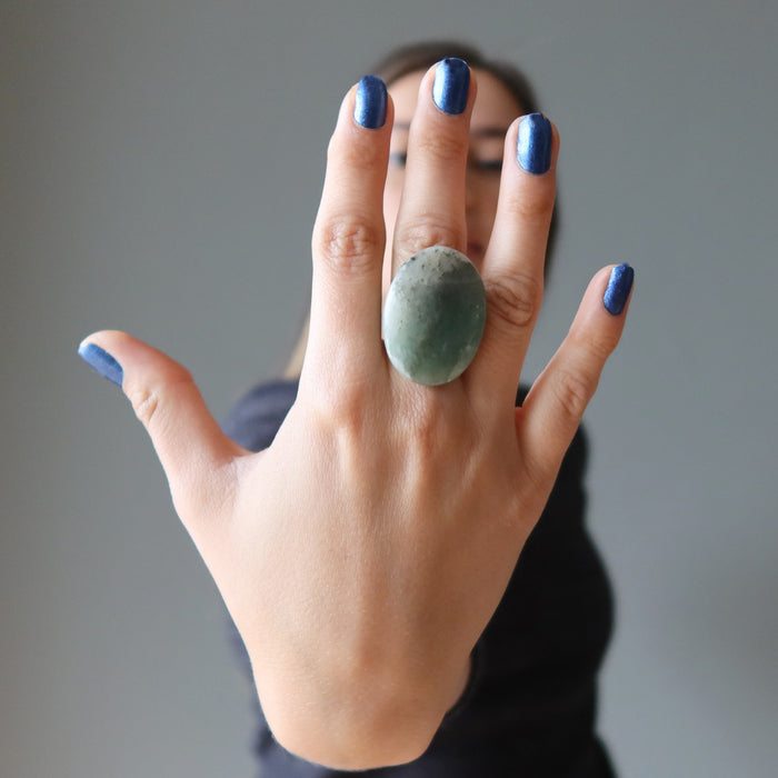 woman wearing large green aventurine oval ring