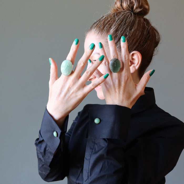 woman wearing two aventurine rings