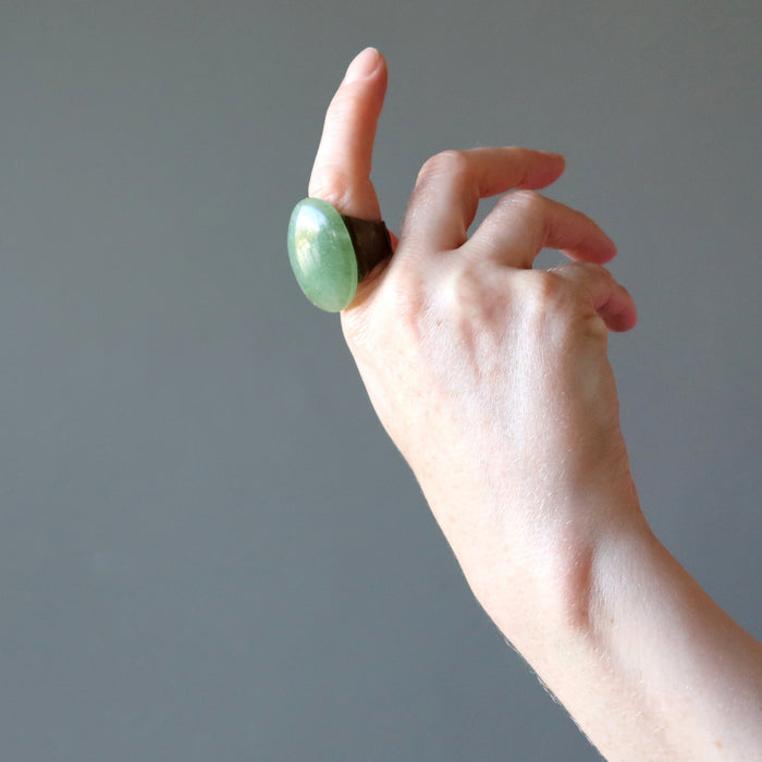 hand wearing big green aventurine oval adjustable ring
