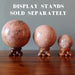 pink aventurine spheres on stands