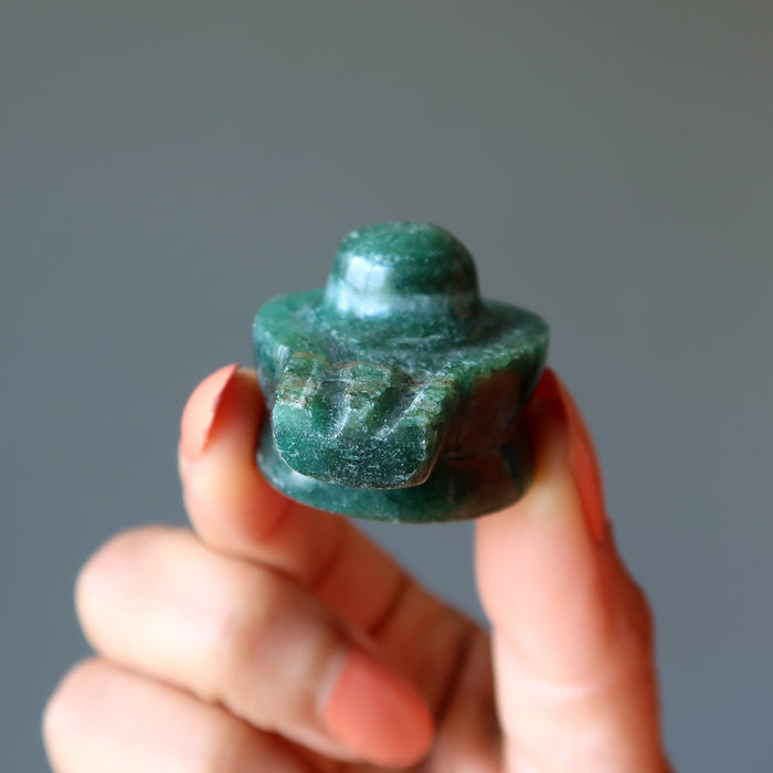 holding Green Aventurine Shivling 