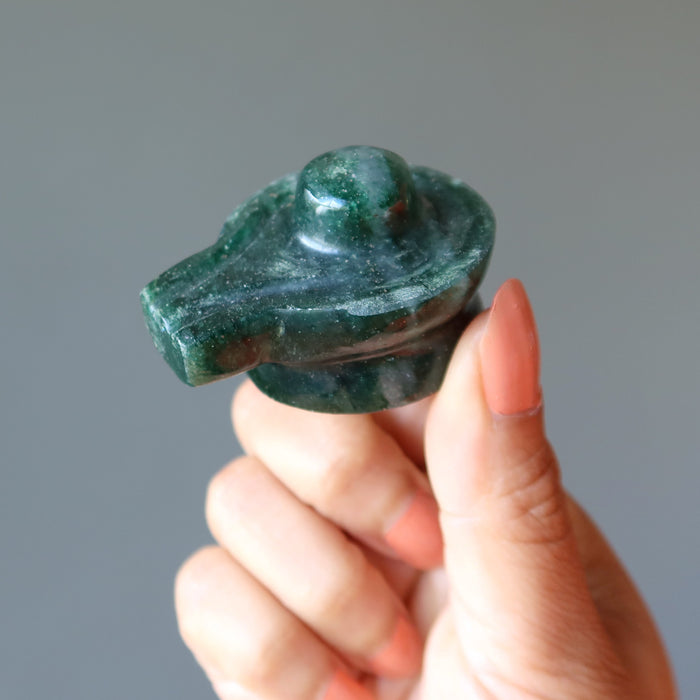 hand holding Green Aventurine Shivling 